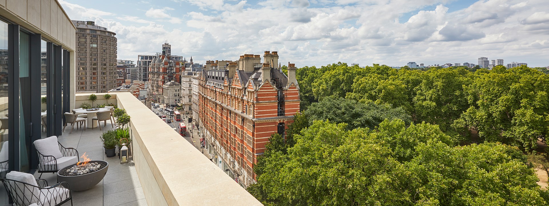 Terrace with two chairs looking out to red brick buildings on Knightsbridge and Hyde Park