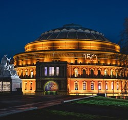 The Royal Albert Hall at nighttime - An illuminated iconic historical structure