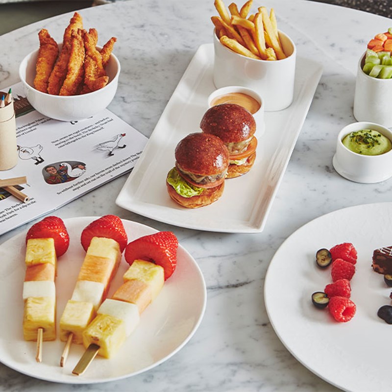 The Berkeley's mini burgers, fruit kebabs, chips and goujons
