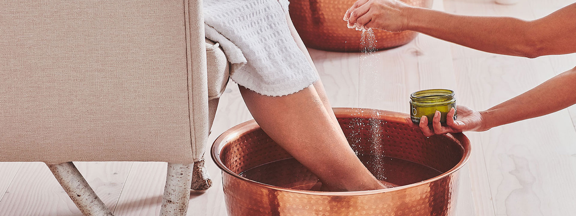 Pedicure process at Bamford Wellness Spa, with aromatic footbath and exfoliation.