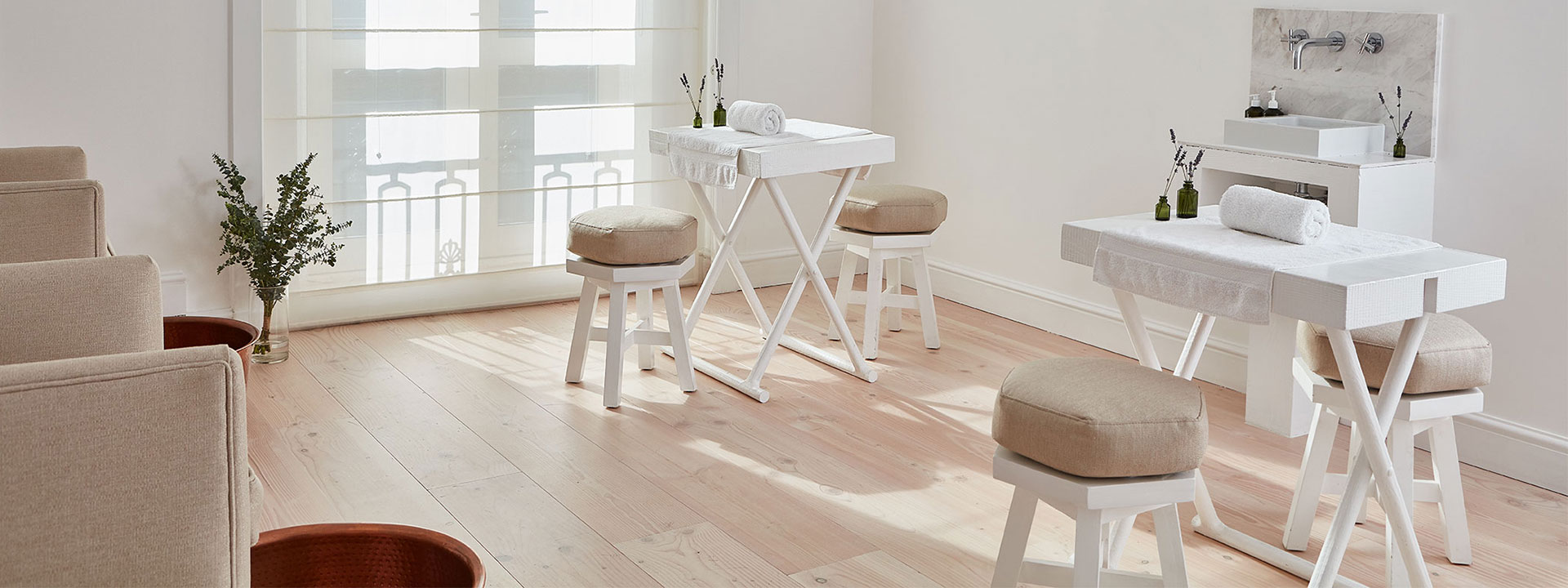 Bamford Wellness Spa's layout featuring a manicure room with lots of daylight and a relaxing atmosphere.