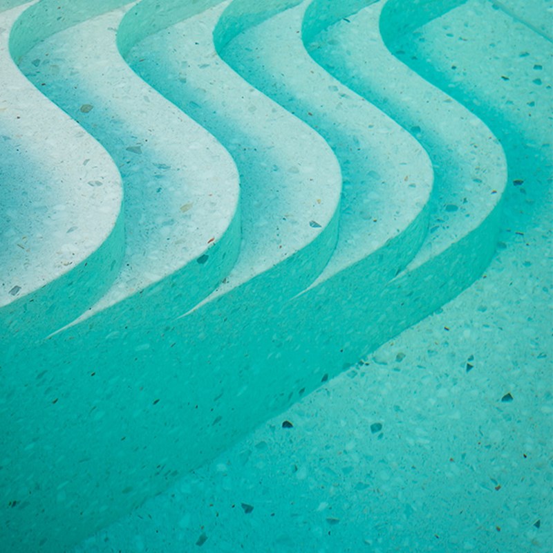 The steps leading down into the pool water