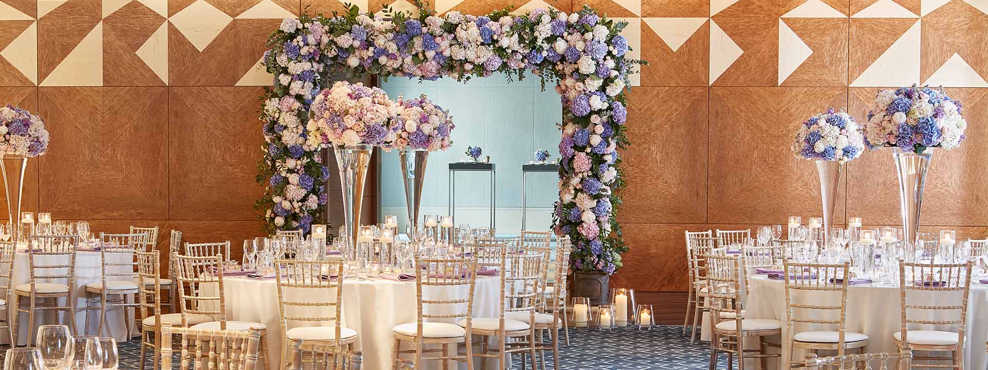 The event space, the Ballroom at The Berkeley, is decorated with floral arrangements for celebrations such as weddings.