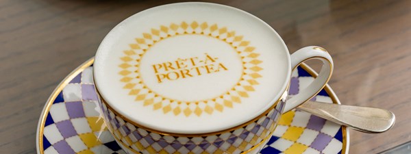 Coffee art of Pret a Portea on top of coffee in cup