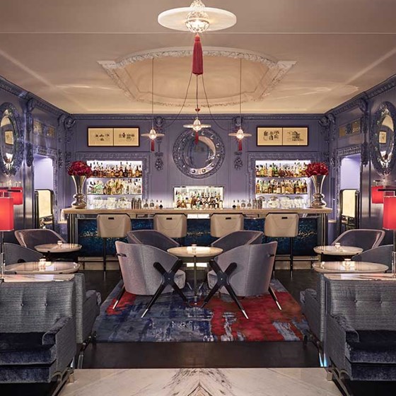 The Blue Bar interior with blue walls, blue chairs and blue carpets at The Berkeley