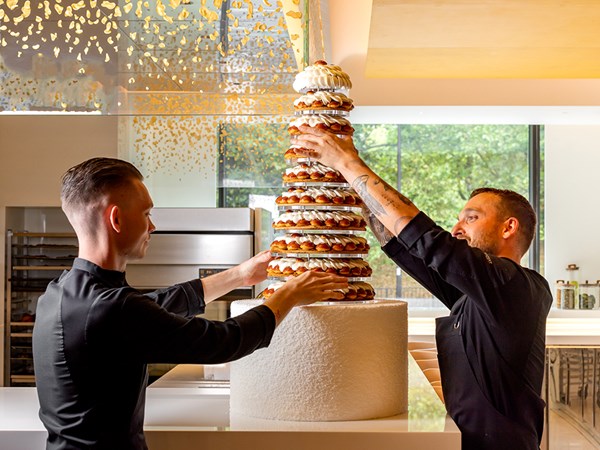 Chef finishing a celebration cake at Cédric Grolet.