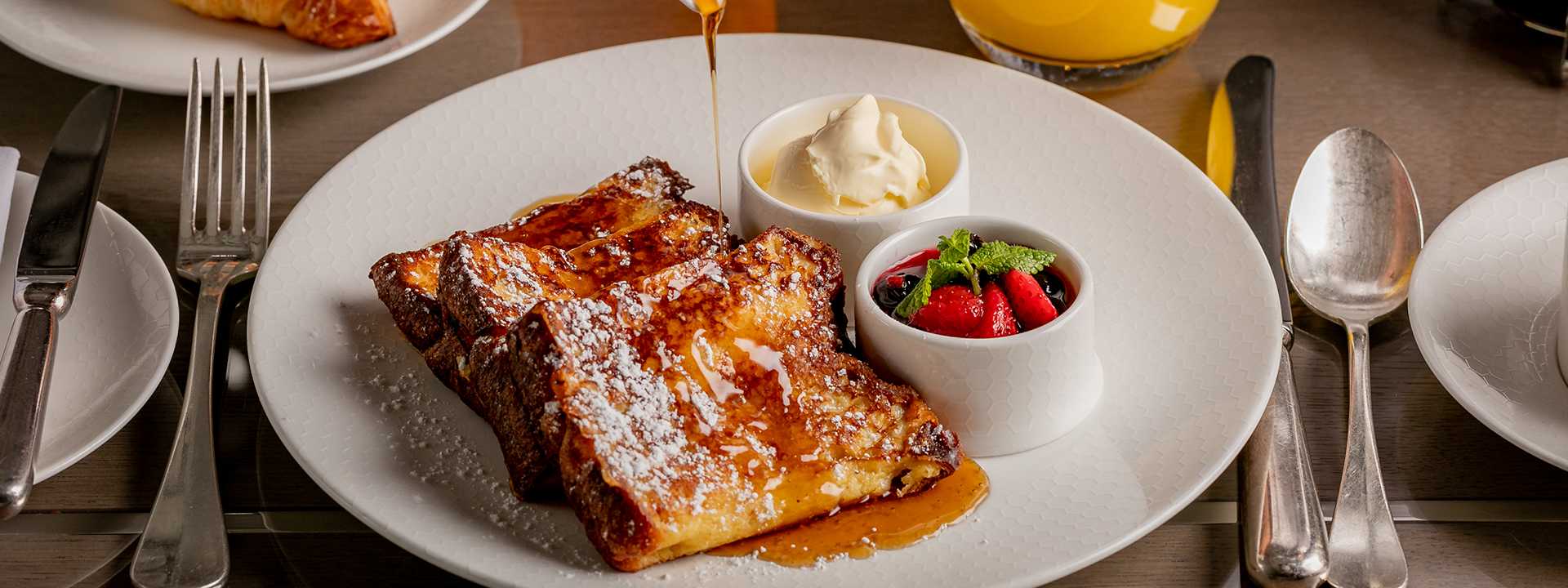 French brioche toast with cream and berry compote, a sweet breakfast that can be ordered in the Collins Room.
