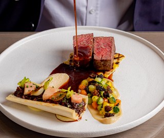 Beef and bone narrow served in a plate at the Collins Room at The Berkeley.