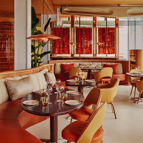 Restaurant interior of abc kitchens. Tables and chairs are dotted around the room