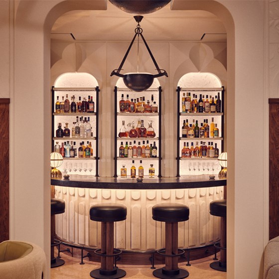 The Berkely Bar & Terrace interior with leather stools around the bar at The Berkeley
