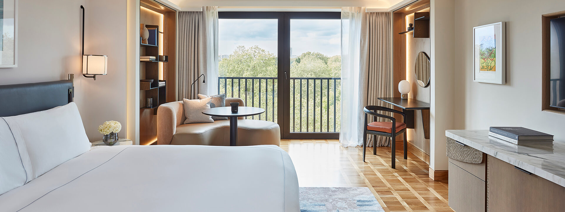 The Berkeley Room displaying a king bed, table, chair and view from the window