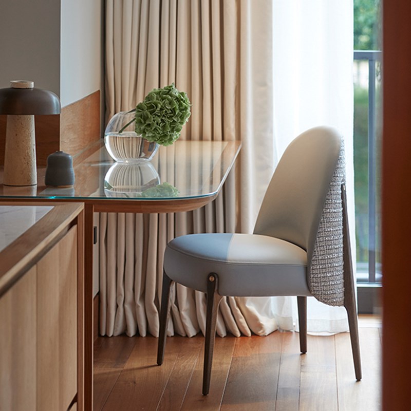 Park Suite at The Berkeley - detail shot of the office area with chair and desk table with vase and flowers on it.