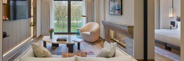 coffee table, pink tulips, chairs and view over hyde park