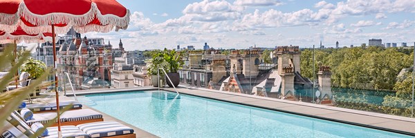 The Berkeley rooftop pool with sunbeds and view over London rooftops