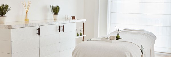 spa treatment room, white bed