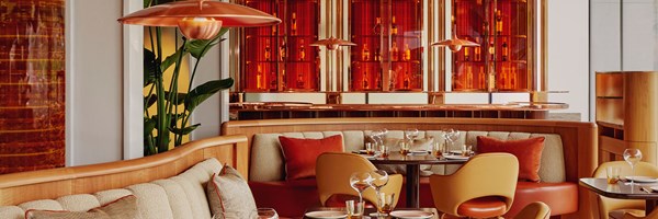 Restaurant interior of abc kitchens. Tables and chairs are dotted around the room